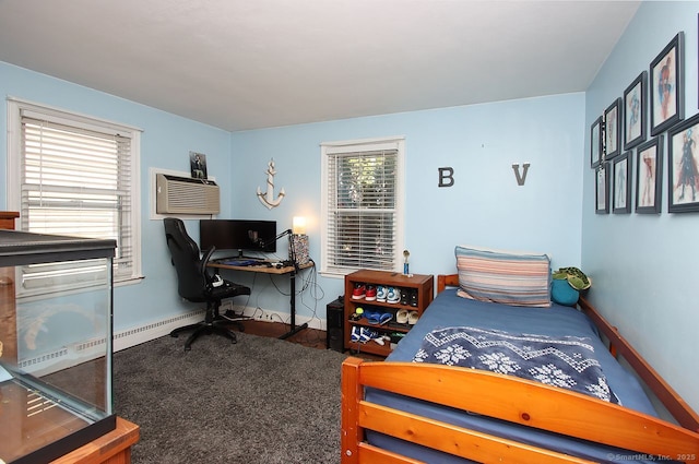 bedroom with baseboards and a wall unit AC