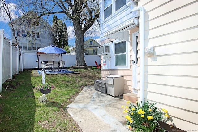 view of yard with a patio and a fenced backyard