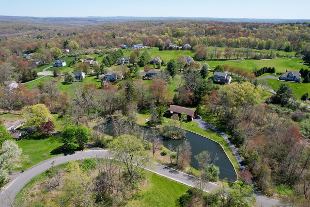 bird's eye view featuring a water view and a view of trees