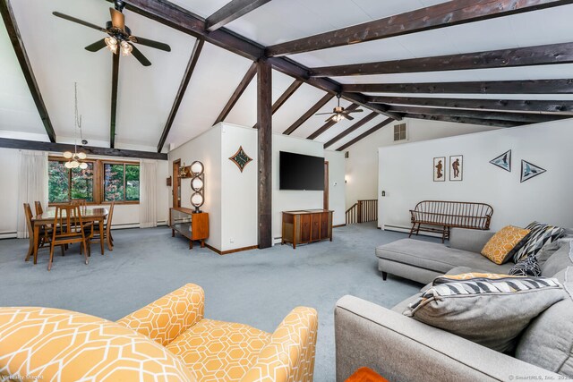 living area featuring baseboards, lofted ceiling with beams, a ceiling fan, and visible vents
