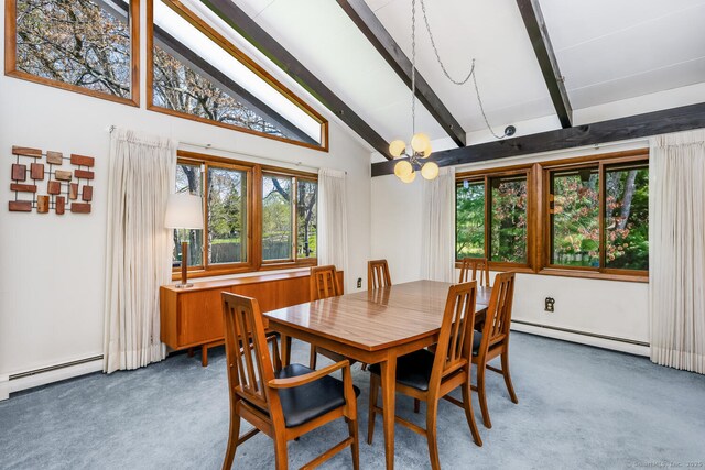 carpeted dining space with beamed ceiling, a notable chandelier, baseboard heating, and high vaulted ceiling