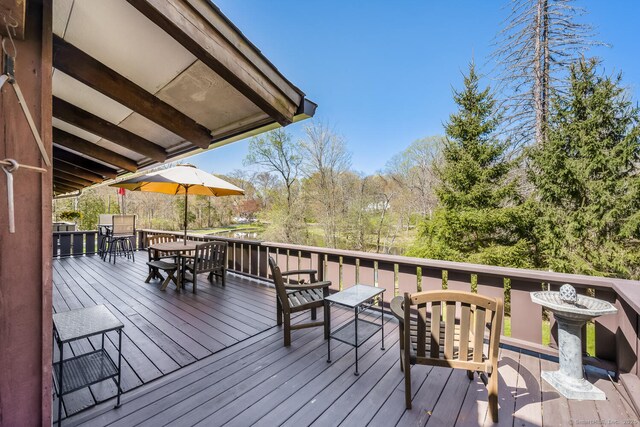 wooden deck with outdoor dining space