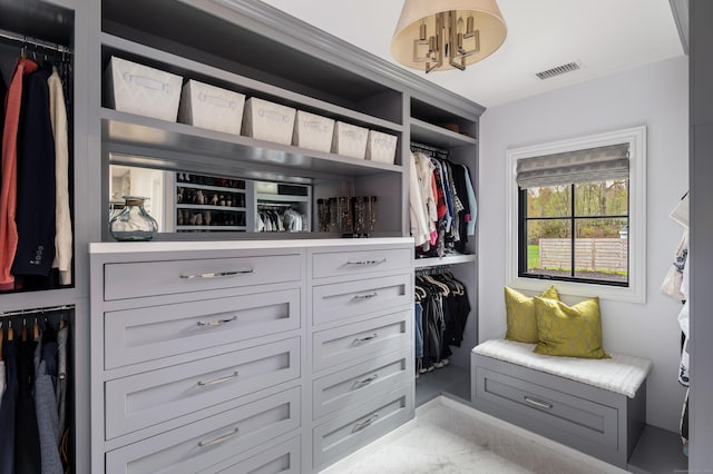 spacious closet featuring visible vents