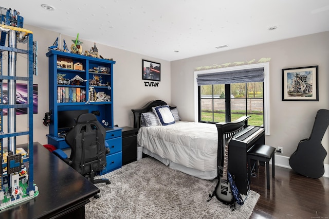 bedroom with recessed lighting, visible vents, wood finished floors, and baseboards