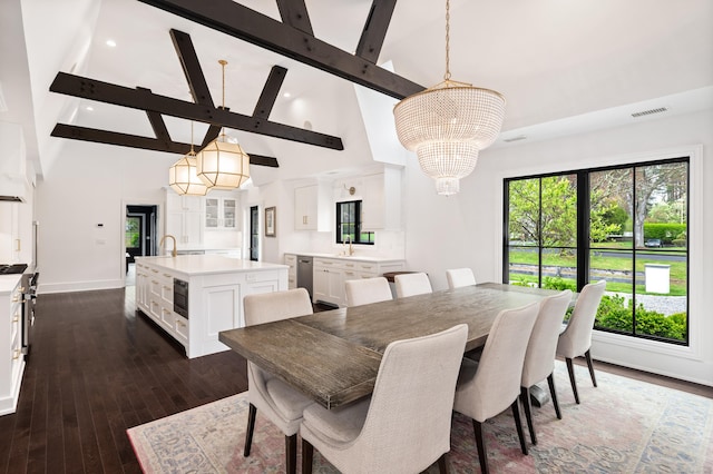 dining space featuring beamed ceiling, a notable chandelier, high vaulted ceiling, visible vents, and baseboards