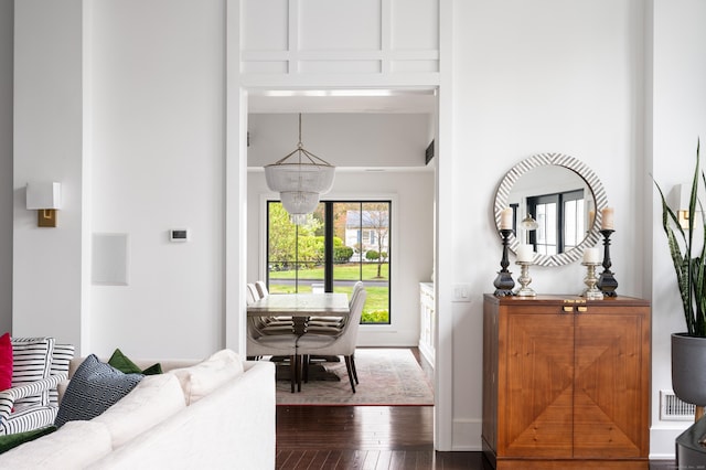 foyer featuring visible vents and dark wood finished floors
