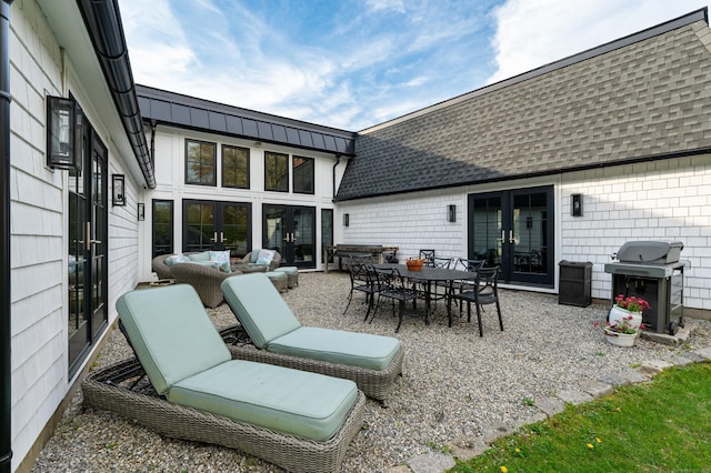view of patio / terrace featuring outdoor lounge area, french doors, outdoor dining space, and grilling area