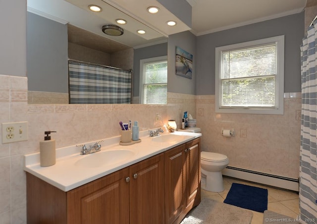 bathroom featuring tile walls, tile patterned flooring, a sink, a baseboard heating unit, and ornamental molding