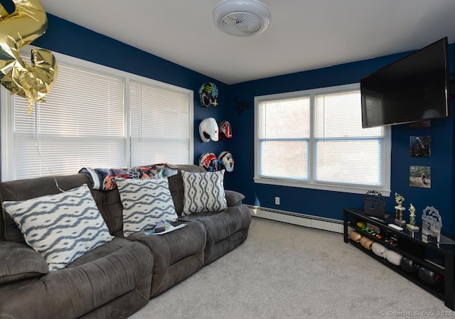 living room featuring baseboards, carpet flooring, and a baseboard heating unit