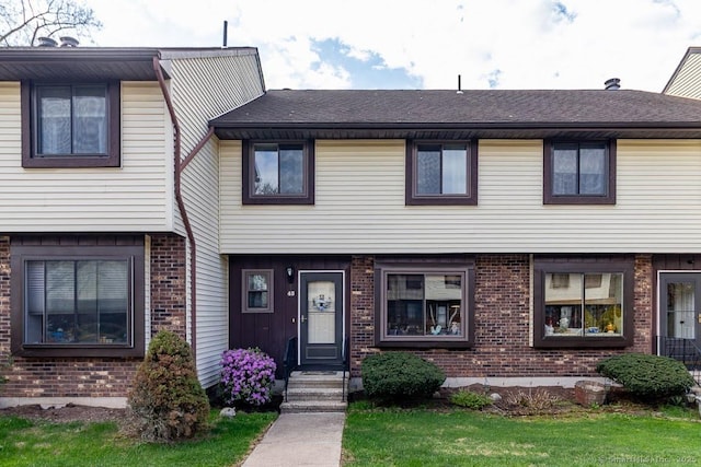 multi unit property featuring brick siding