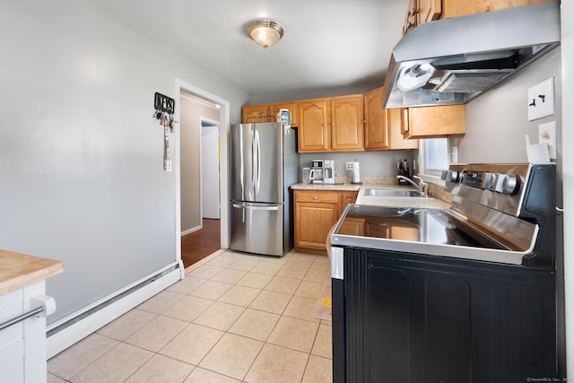 kitchen with freestanding refrigerator, a baseboard radiator, range hood, electric range oven, and a sink