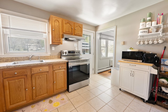 kitchen featuring appliances with stainless steel finishes, a sink, light countertops, a baseboard radiator, and under cabinet range hood
