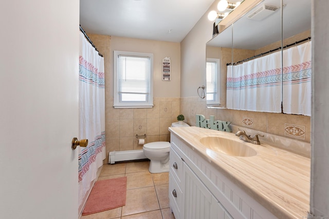 bathroom featuring visible vents, tile patterned floors, a baseboard radiator, vanity, and toilet