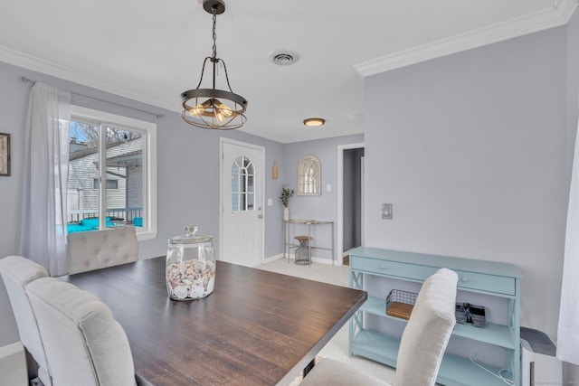 dining space with visible vents, crown molding, and baseboards