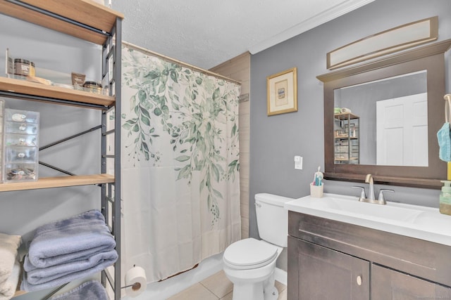 full bath featuring tile patterned floors, toilet, vanity, a textured ceiling, and crown molding