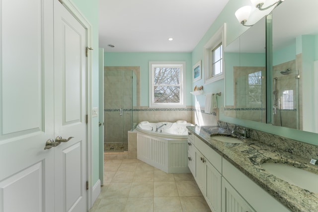 6 Holdridge Ct, Groton, CT 06355 - full bathroom featuring tile patterned floors, a shower stall, a garden tub, and a sink