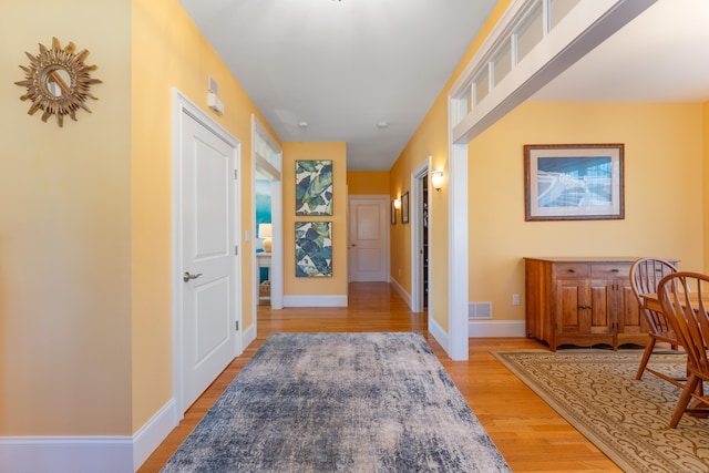 6 Holdridge Ct, Groton, CT 06355 - hall featuring visible vents, light wood finished floors, and baseboards