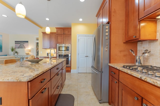 6 Holdridge Ct, Groton, CT 06355 - kitchen featuring decorative backsplash, stainless steel appliances, light stone countertops, and brown cabinetry