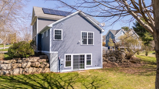 6 Holdridge Ct, Groton, CT 06355 - rear view of property with roof mounted solar panels and a lawn