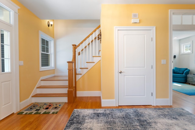 6 Holdridge Ct, Groton, CT 06355 - foyer with stairway, wood finished floors, and baseboards