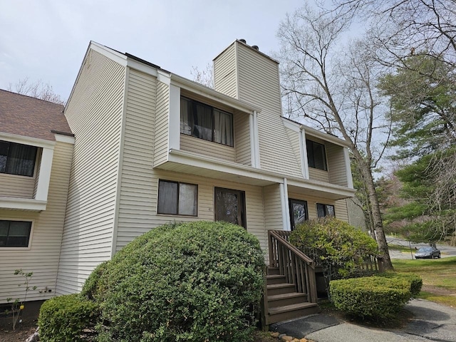 townhome / multi-family property with a chimney