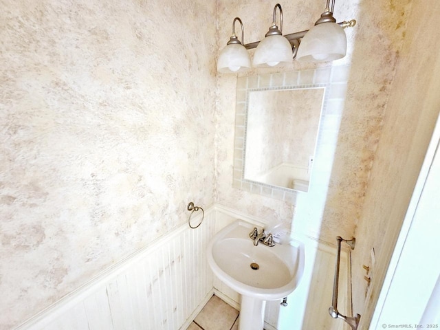 bathroom with tile patterned floors and a sink