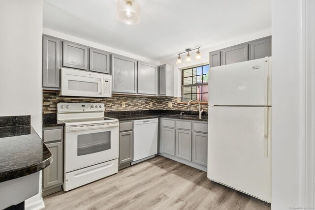 268 Lawlor St Apt 6, New Britain, CT 06051 - kitchen with white appliances, gray cabinets, backsplash, and light wood-style floors
