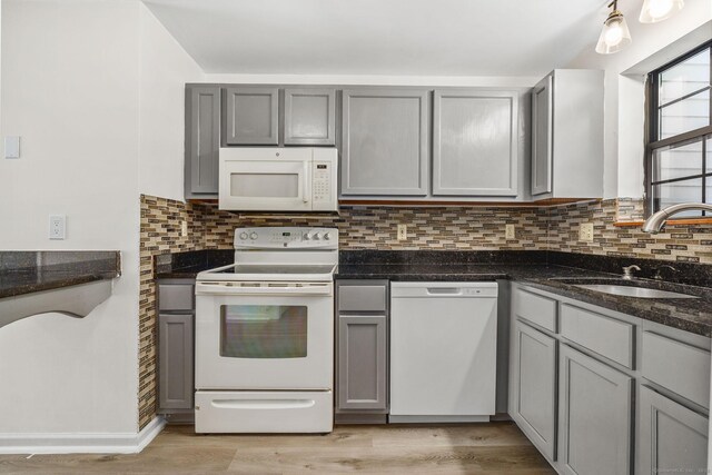268 Lawlor St Apt 6, New Britain, CT 06051 - kitchen with white appliances, gray cabinets, and light wood finished floors
