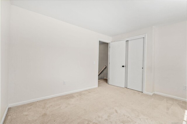268 Lawlor St Apt 6, New Britain, CT 06051 - unfurnished bedroom with light colored carpet and a closet