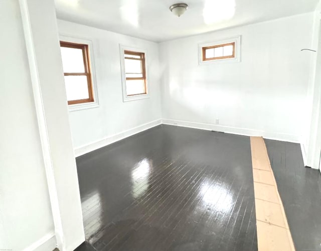 4 Culver Ct, Naugatuck, CT 06770 - empty room featuring dark wood-type flooring and baseboards