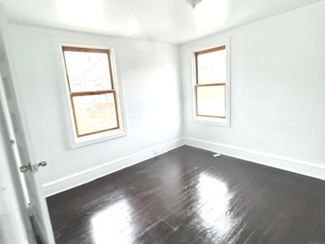 4 Culver Ct, Naugatuck, CT 06770 - unfurnished room featuring baseboards, dark wood finished floors, and healthy amount of natural light
