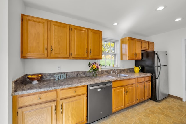 kitchen with appliances with stainless steel finishes, recessed lighting, baseboards, and a sink