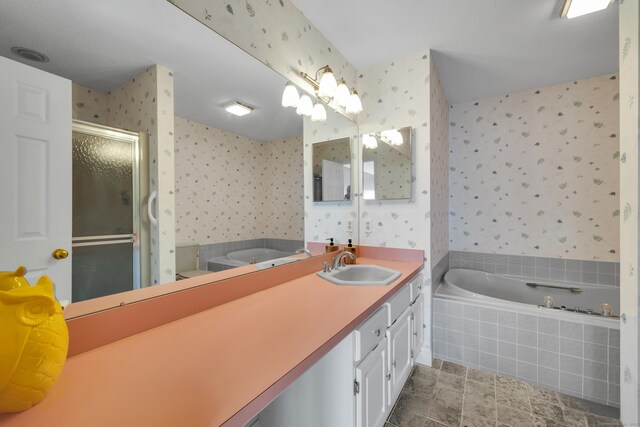 bathroom with a garden tub, a stall shower, wallpapered walls, and vanity