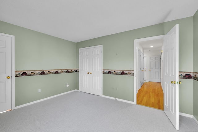 interior space with carpet flooring and baseboards