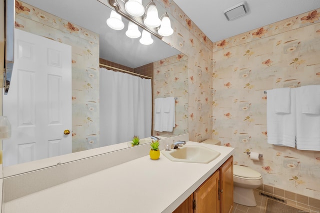bathroom featuring visible vents, wallpapered walls, toilet, tile patterned floors, and vanity
