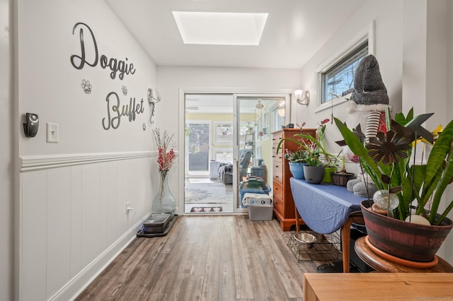9 Berkshire Dr, Danbury, CT 06811 - interior space featuring a skylight, wainscoting, wood finished floors, and a wealth of natural light