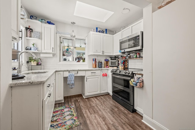 9 Berkshire Dr, Danbury, CT 06811 - kitchen with white cabinets, stainless steel appliances, a skylight, and a sink