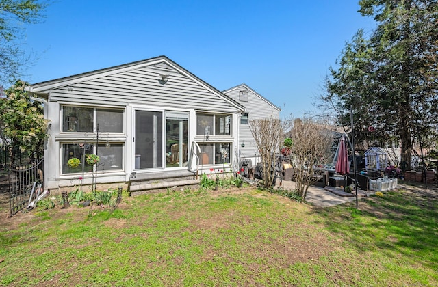 9 Berkshire Dr, Danbury, CT 06811 - rear view of property featuring a yard and a sunroom