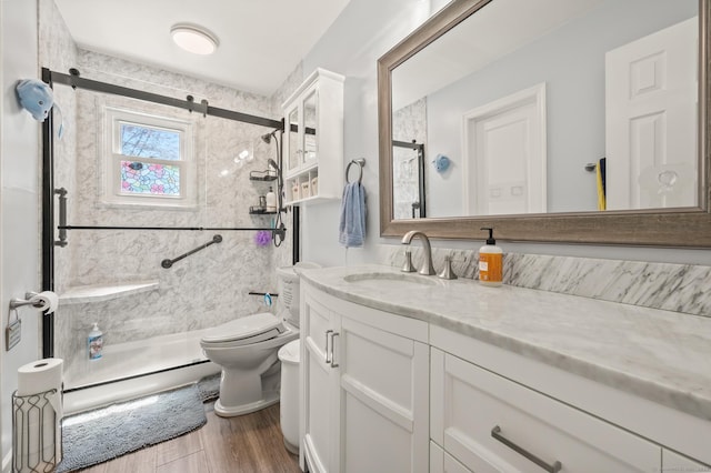 9 Berkshire Dr, Danbury, CT 06811 - full bathroom with vanity, toilet, wood finished floors, and a stall shower