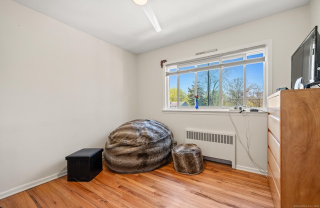 9 Berkshire Dr, Danbury, CT 06811 - living area featuring radiator heating unit, baseboards, and light wood-style floors
