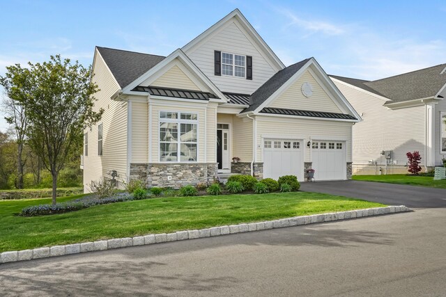 14 Enclave Cir Unit 14, Newtown, CT 06470 - view of front of property featuring stone siding, a front yard, a standing seam roof, driveway, and metal roof