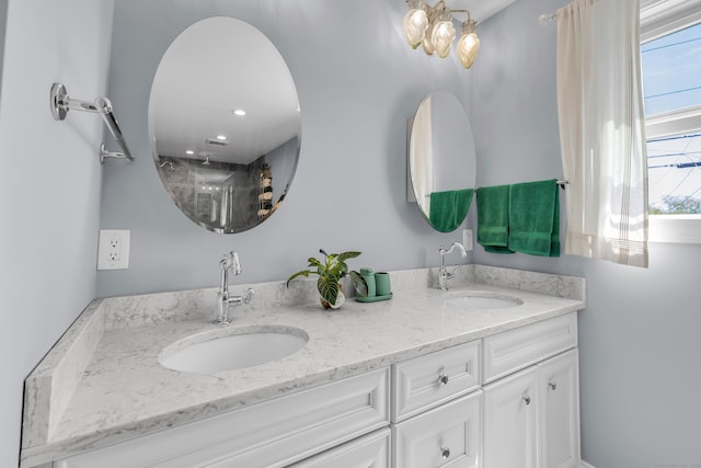 full bath featuring double vanity and a sink