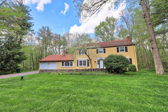 30 Sunset Hill Rd, Simsbury, CT 06070 - colonial house featuring a chimney, asphalt driveway, and a front yard