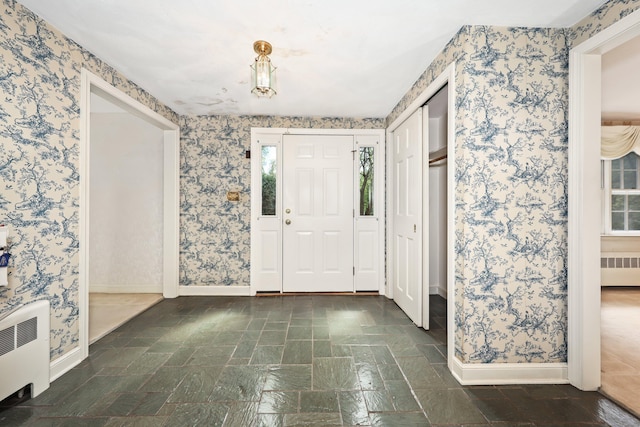 30 Sunset Hill Rd, Simsbury, CT 06070 - foyer featuring radiator heating unit, wallpapered walls, baseboards, and plenty of natural light