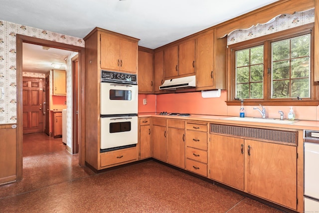 30 Sunset Hill Rd, Simsbury, CT 06070 - kitchen featuring wallpapered walls, white double oven, under cabinet range hood, light countertops, and a sink