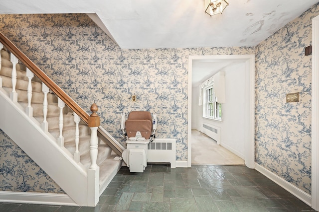 30 Sunset Hill Rd, Simsbury, CT 06070 - entryway with radiator heating unit, baseboards, stairway, wallpapered walls, and stone finish floors