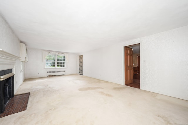 30 Sunset Hill Rd, Simsbury, CT 06070 - unfurnished living room featuring radiator heating unit, a fireplace, and carpet floors
