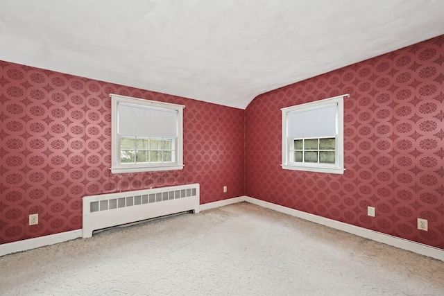 30 Sunset Hill Rd, Simsbury, CT 06070 - carpeted spare room featuring radiator heating unit, baseboards, lofted ceiling, and wallpapered walls