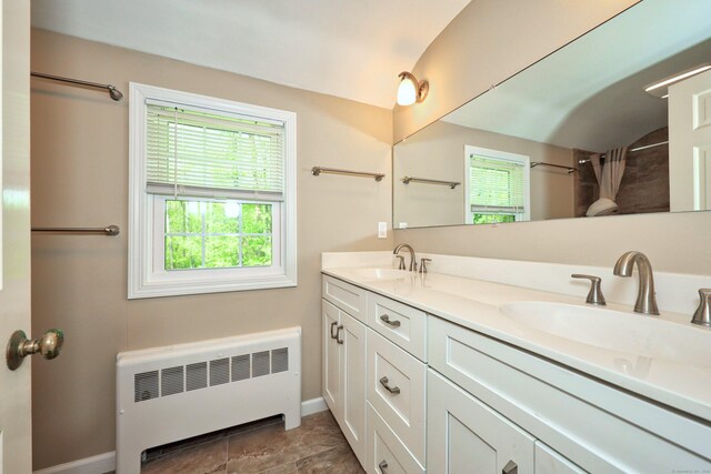 30 Sunset Hill Rd, Simsbury, CT 06070 - bathroom featuring radiator heating unit, baseboards, double vanity, vaulted ceiling, and curtained shower