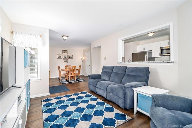 20 E Pembroke Rd Unit 36, Danbury, CT 06811 - living room featuring dark wood-type flooring and baseboards
